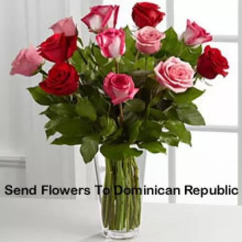4 Red, 4 Pink And 4 Dual Toned Roses With Seasonal Fillers In A Glass Vase