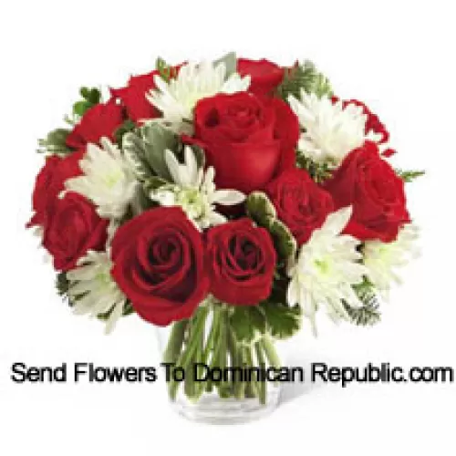 This Bouquet is a charming display of holiday beauty and winter warmth. Rich red roses and spray roses pop against white chrysanthemums, assorted Christmas greens and eucalyptus, arranged in a round clear glass vase to create a gift that will spread the goodwill of the season to your special recipient. (Please Note That We Reserve The Right To Substitute Any Product With A Suitable Product Of Equal Value In Case Of Non-Availability Of A Certain Product)